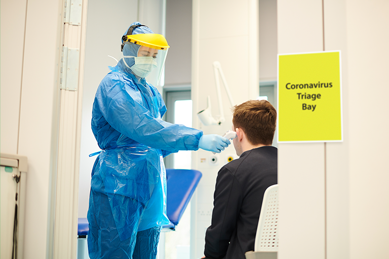 health care worker triaging coronavirus patient